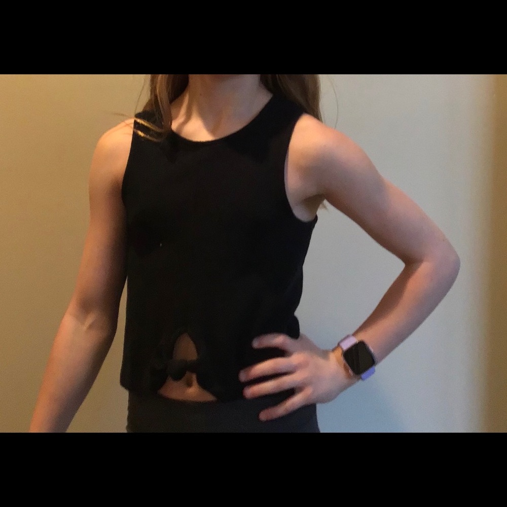 Black tank top with knot.
